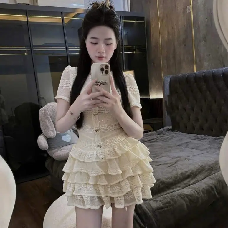 Váy thiết kế tay phồng cổ tròn chân tầng dệt kim sa NQht20